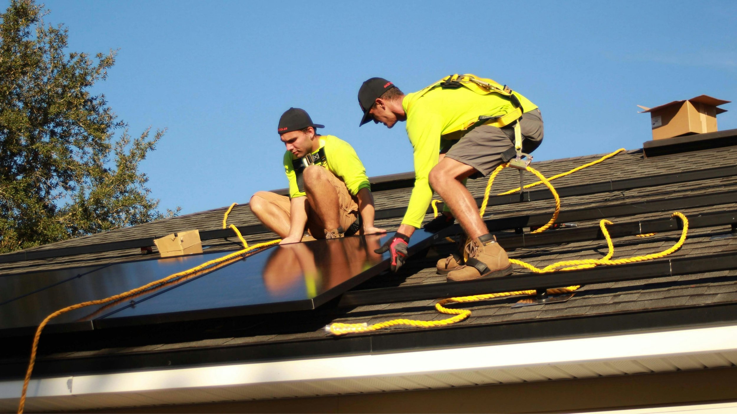 Solar installers on a roof